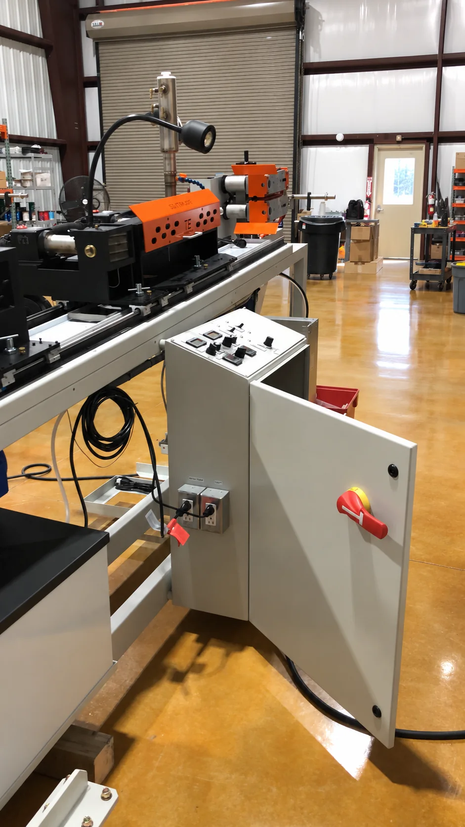Industrial manufacturing machine with local control enclosure and operator controls
